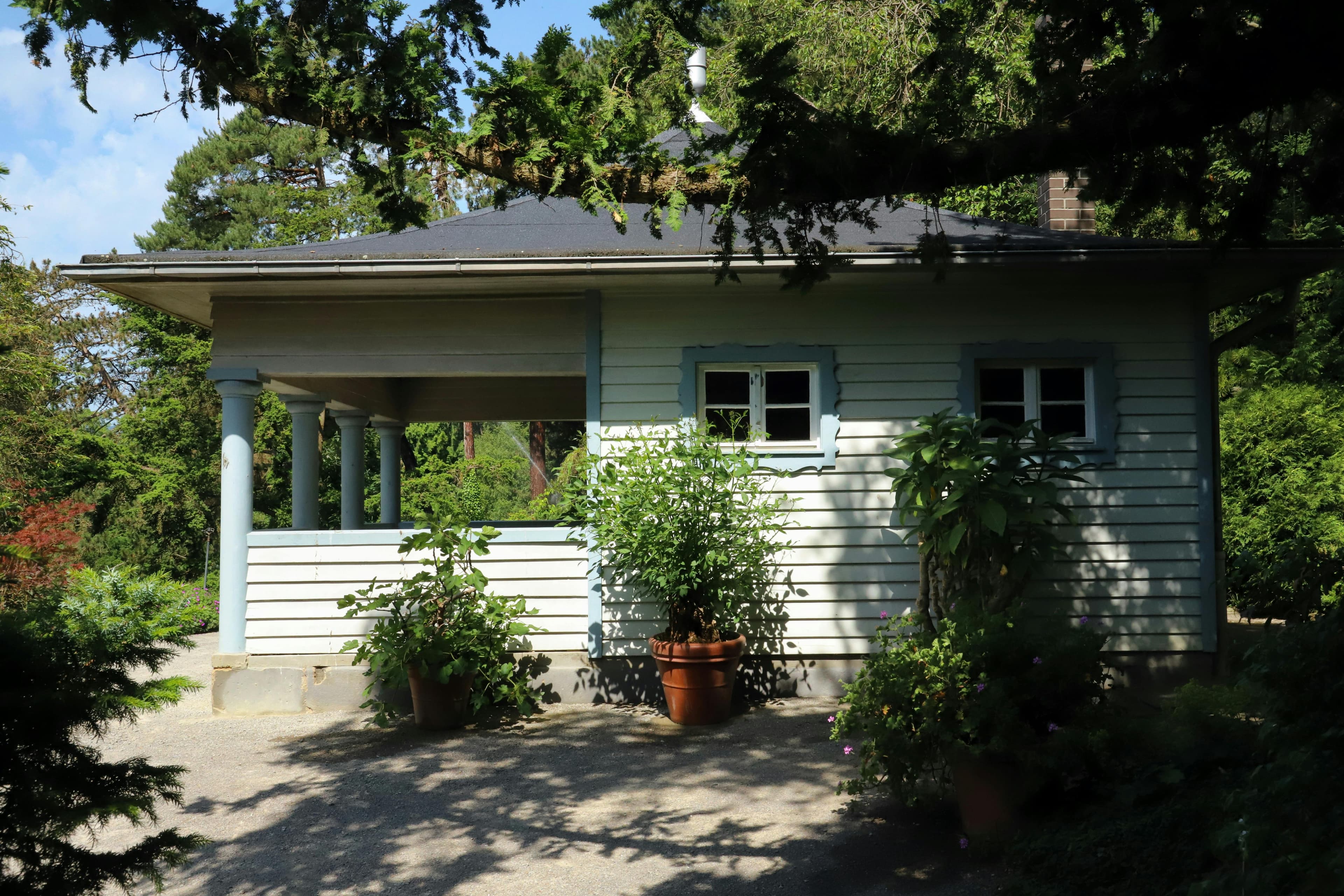 Happy family in front of their home